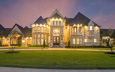 A luxury home at sunset.