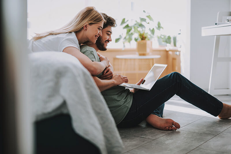 First time homebuyers browsing through home listings