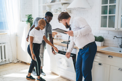 couple-considers-renting-vs-owning-realtor-kitchen