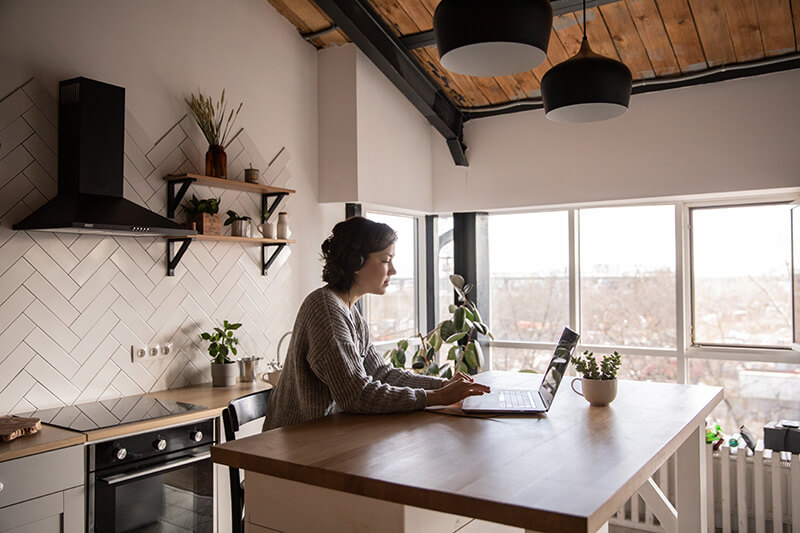 Woman browsing current homes on the market