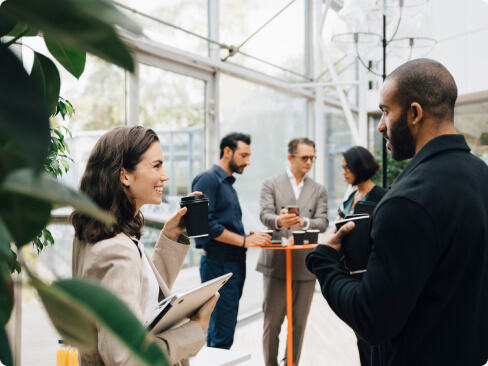 Mortgage loan originators networking at an event.