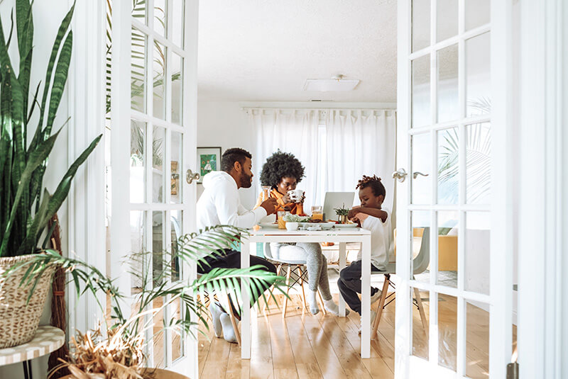 A family enjoying breakfast in their new home