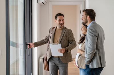 Couple meets with REALTOR to buy a house.