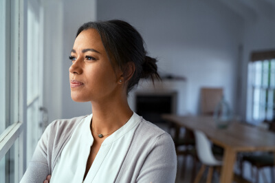 A first-time homebuyer looking out the window