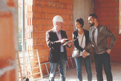 Homeowners on the construction site of their home.