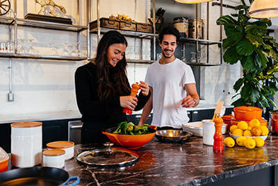 Couple cooking together in their new kitchen