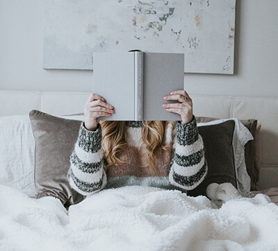 A woman reading a book.