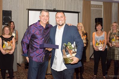 Jeff giving awards to his realtor partners