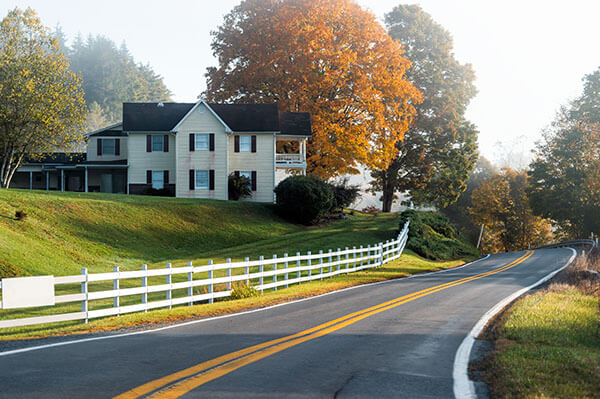 Farmhouse style house on a countryside rural road